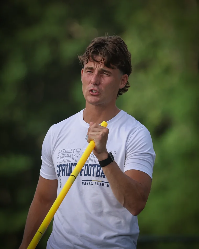Josh Holsopple coaching on the field at KPM