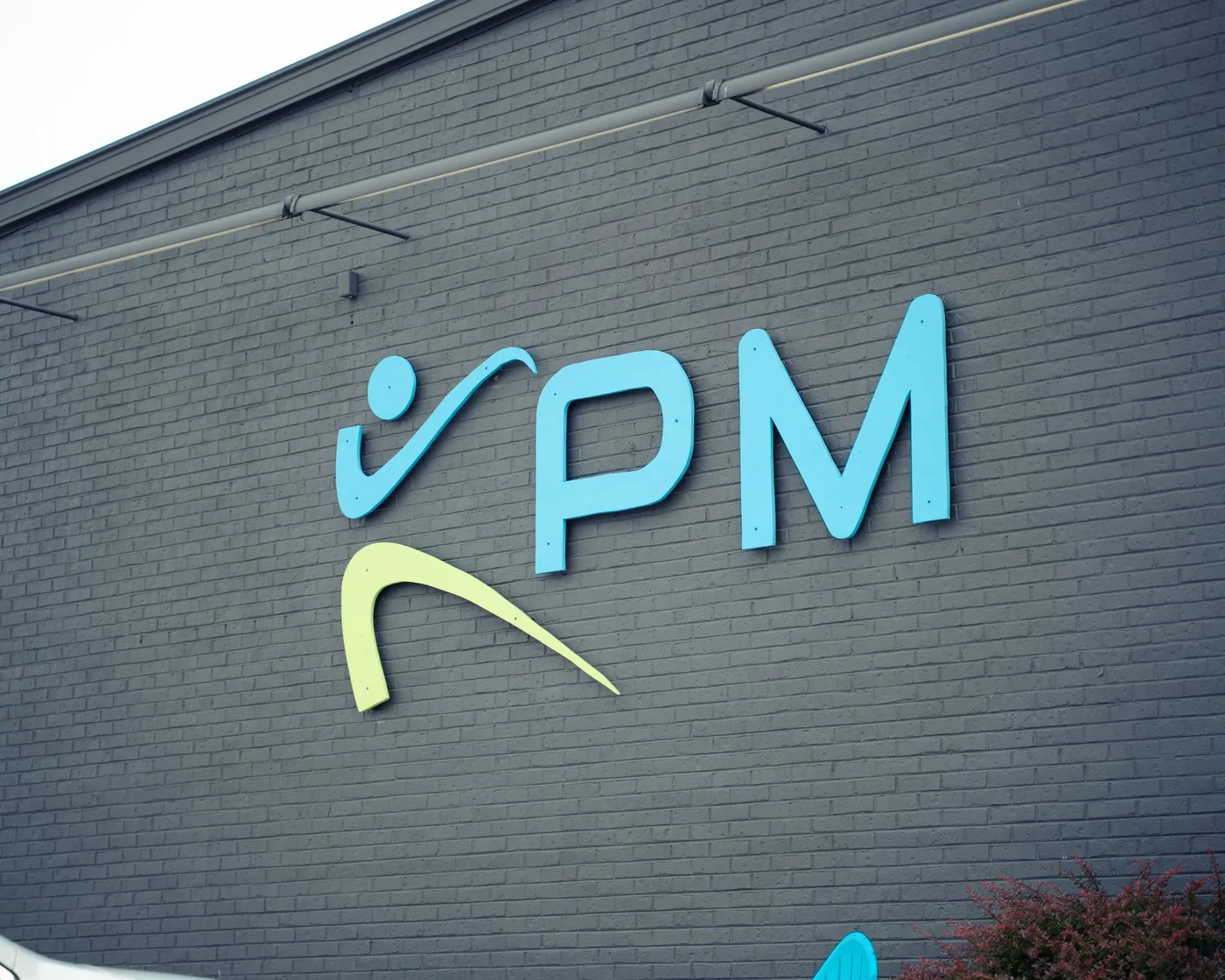The KPM logo on the outside wall of the Somers Point building