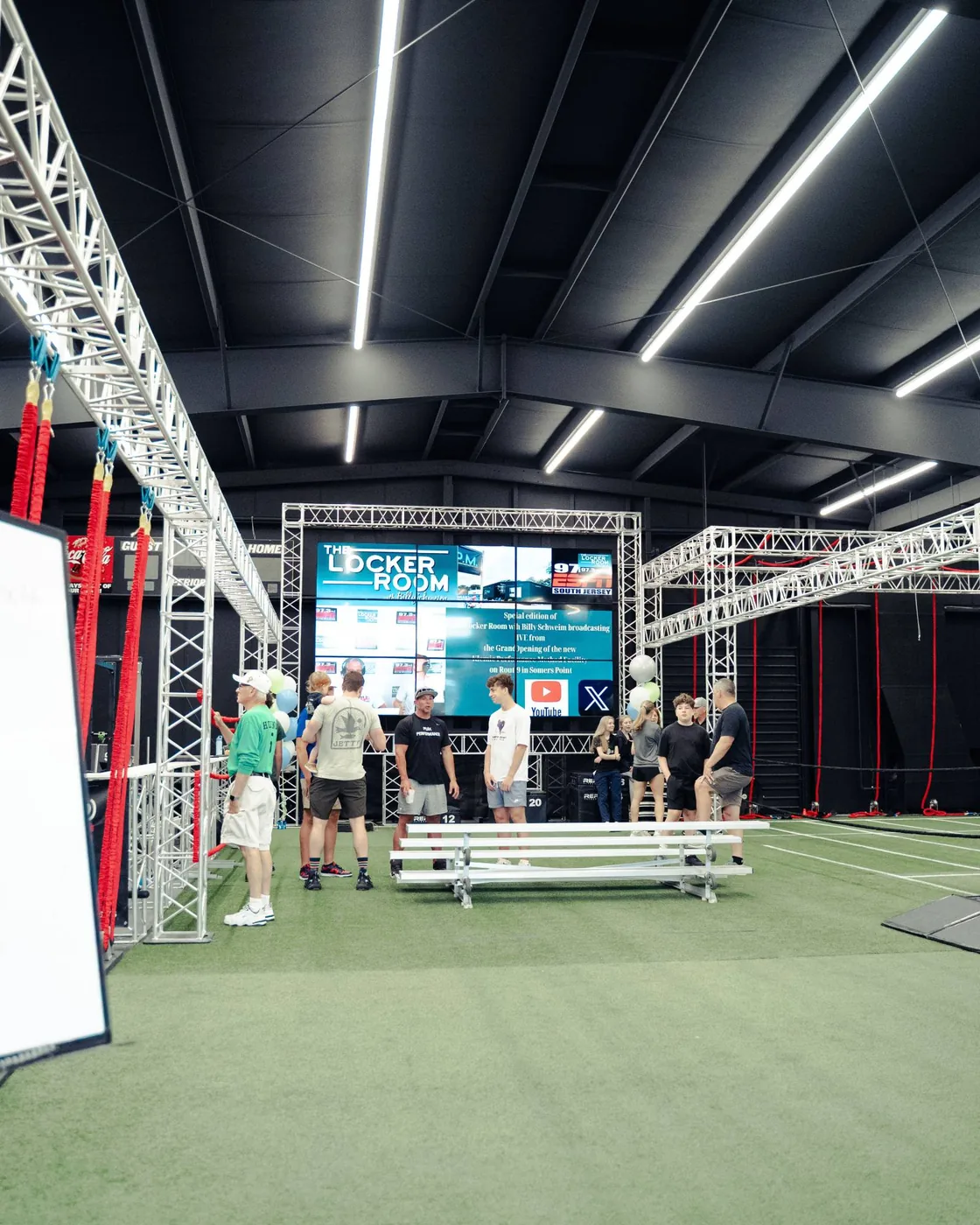 The KPM turf with resistance cords hanging from the truss and the video wall