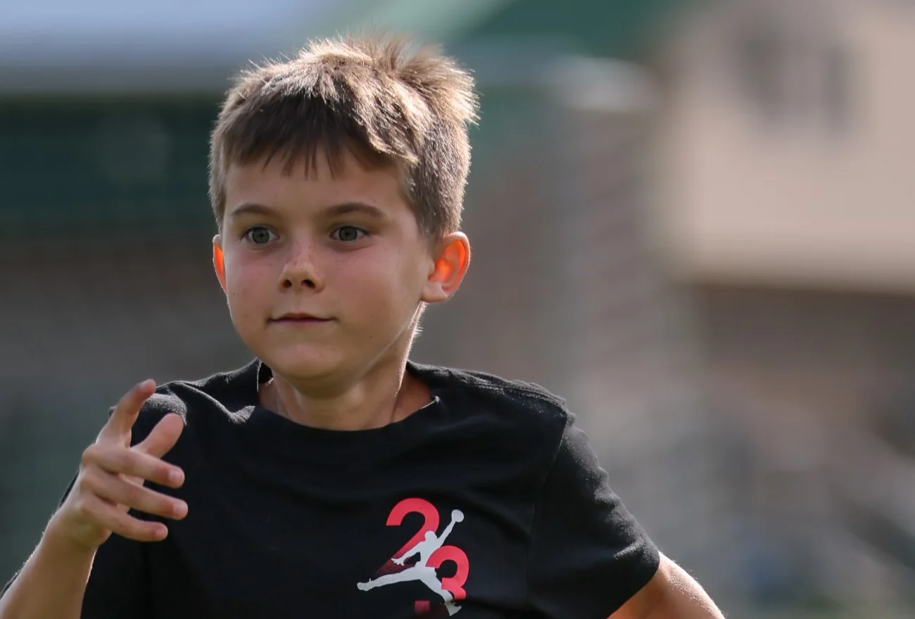 A young boy running during a KPM session