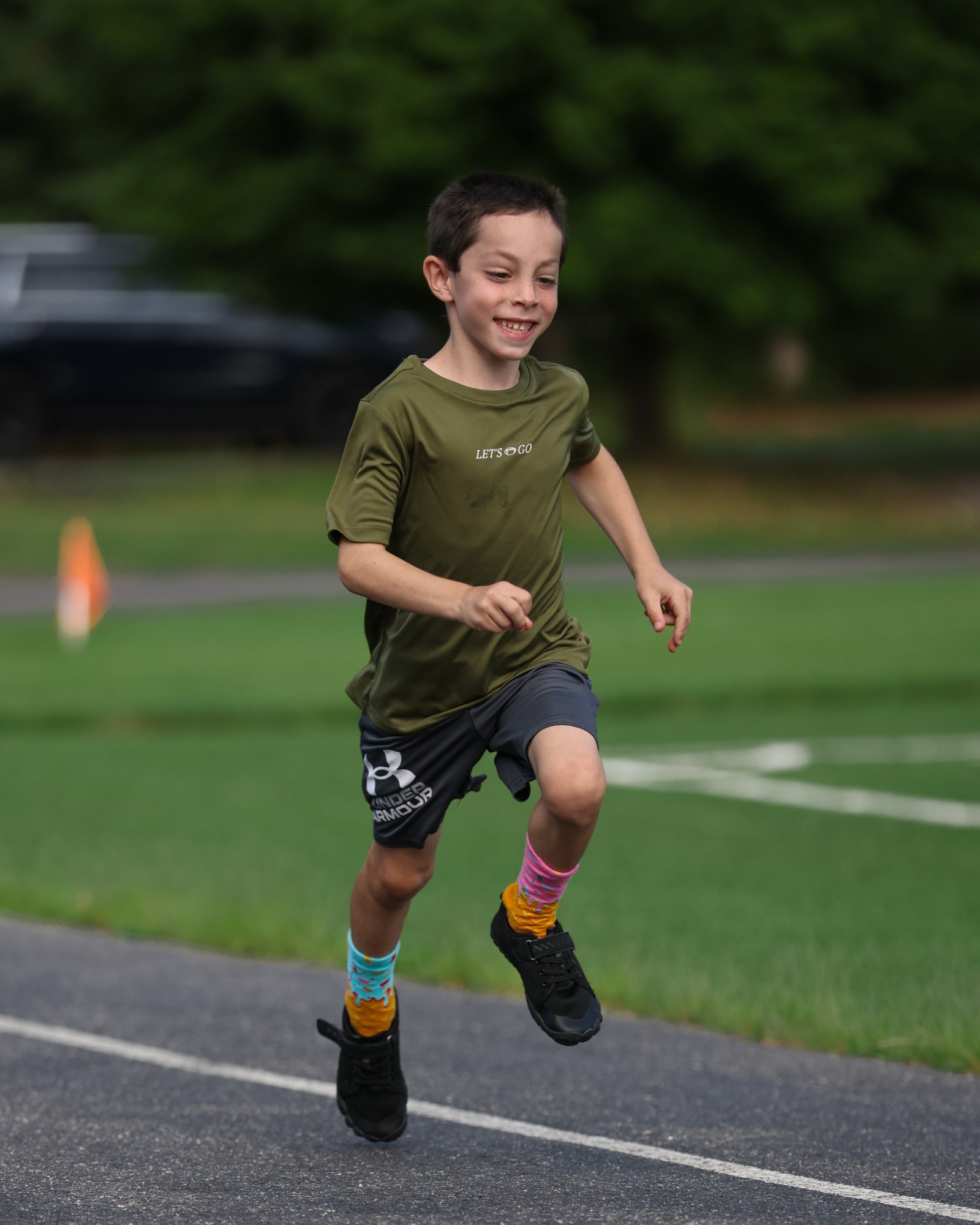 A Young Guns athlete running on the turf.